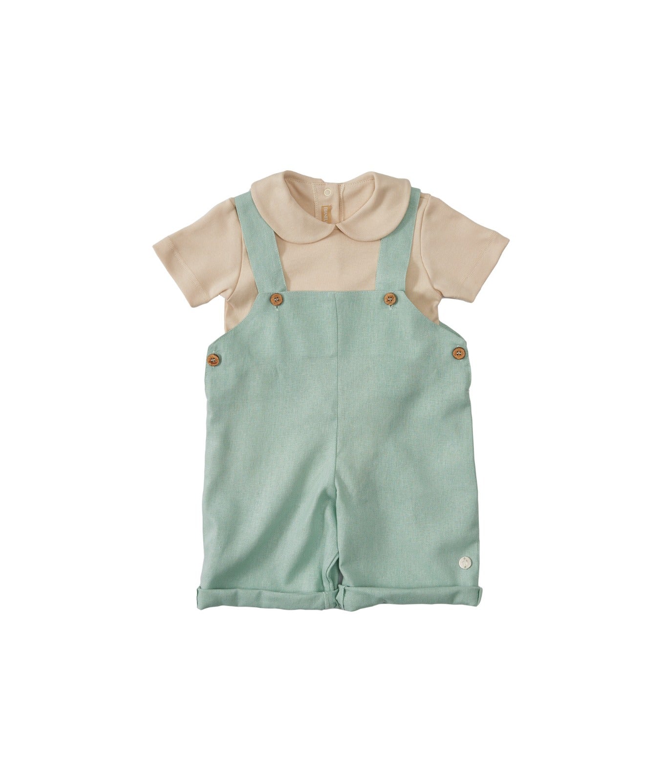 Jardineira Henry verde com decote quadrado, barra dobrada e abotoamento nas alças. Em linho e viscose, veste bebês de 3 a 18 meses.

