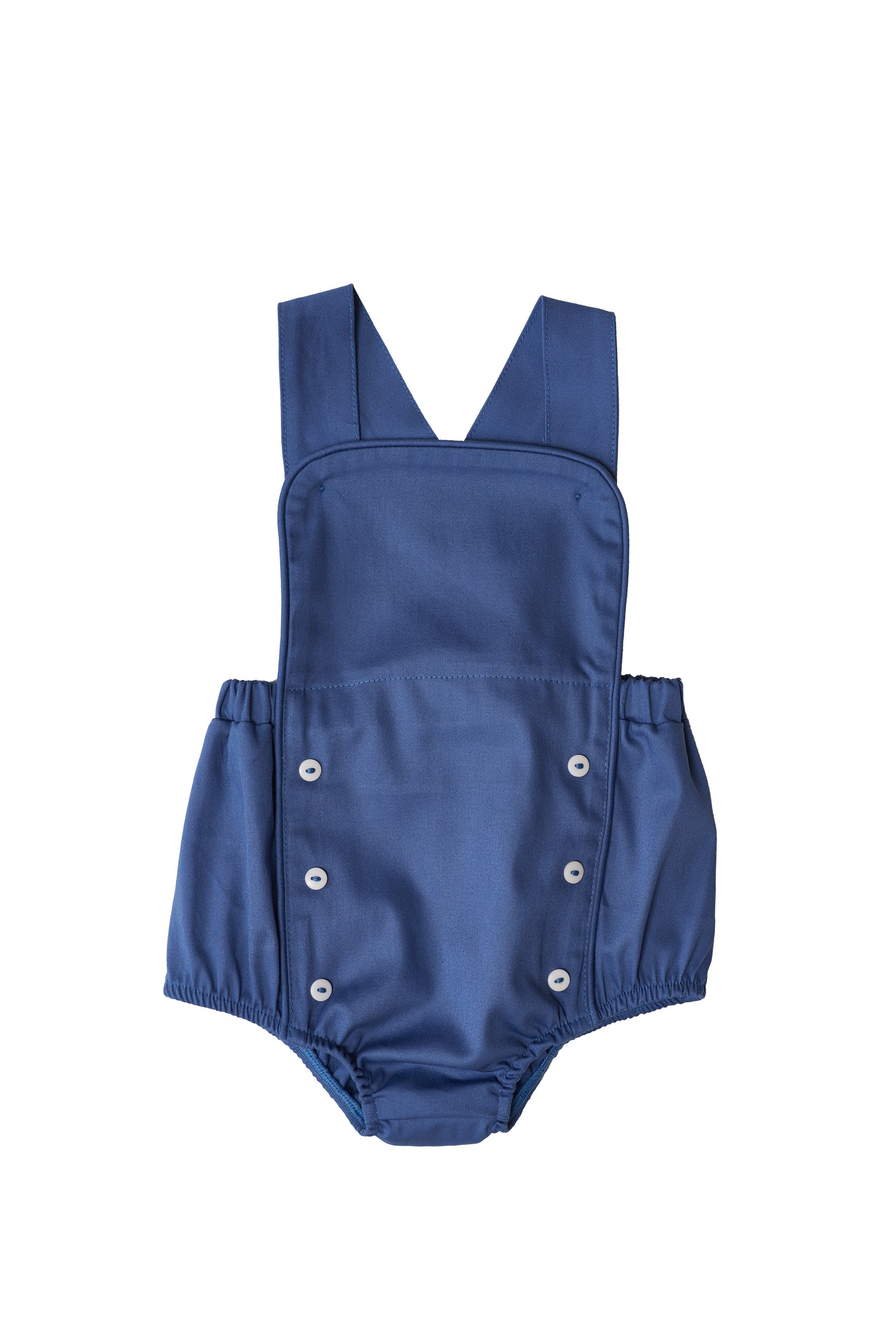 Jardineira Liam em sarja bege com vermelho e azul, edição especial. Clássica, confortável e ideal para bebês de 3 a 18 meses.

